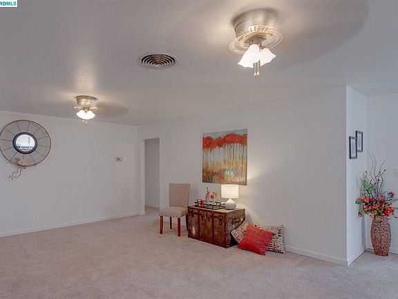 Spacious great room for easy living. New carpet, paint, & blinds.