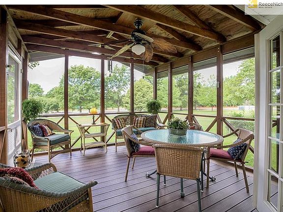 This beautiful screened in deck overlooks Meadowbrook Park