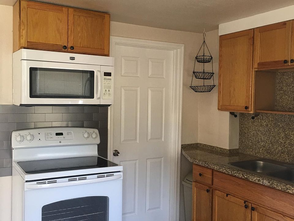 Kitchen - Glass too electric range & microwave.