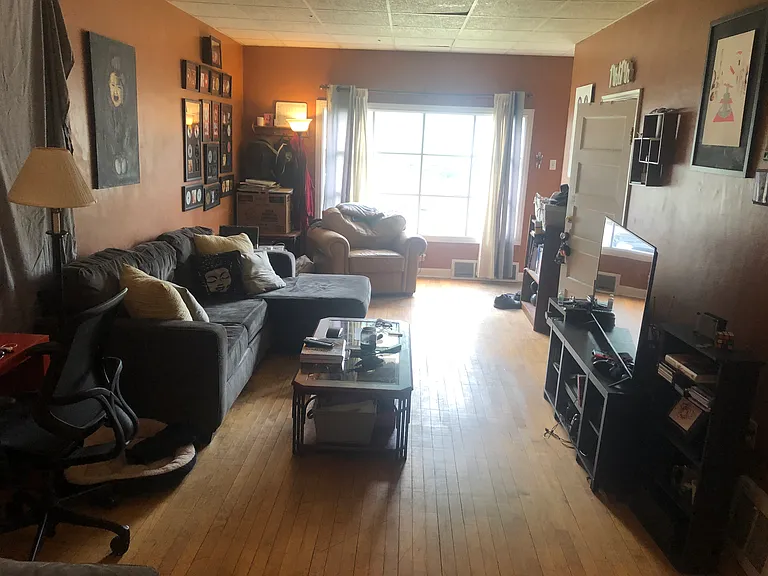 This is the living room as you are in the kitchen looking at the front of the house. The living room is not narrow.