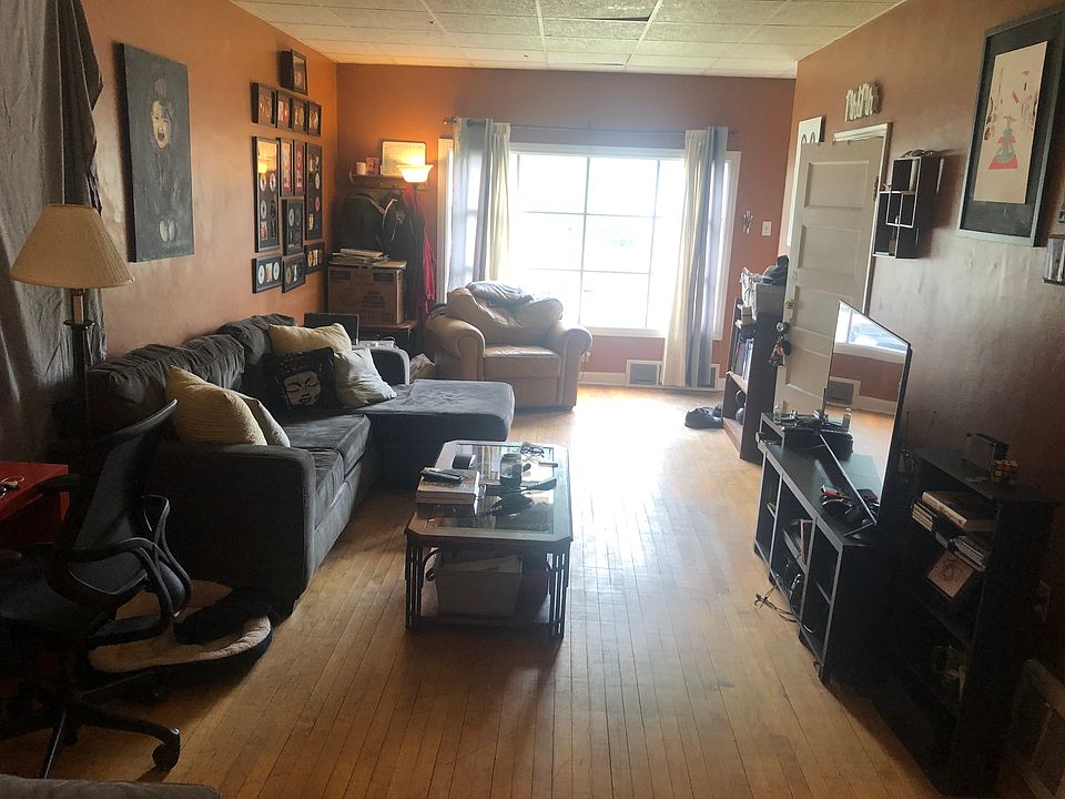 This is the living room as you are in the kitchen looking at the front of the house. The living room is not narrow.