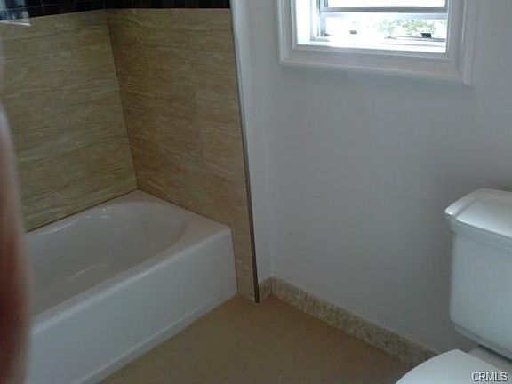 NEW BATHTUB AND TOILET