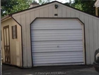 one car garage with storage and work bench
