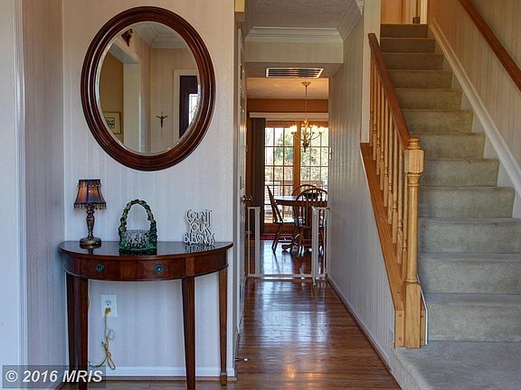 Welcoming foyer with hardwood floors