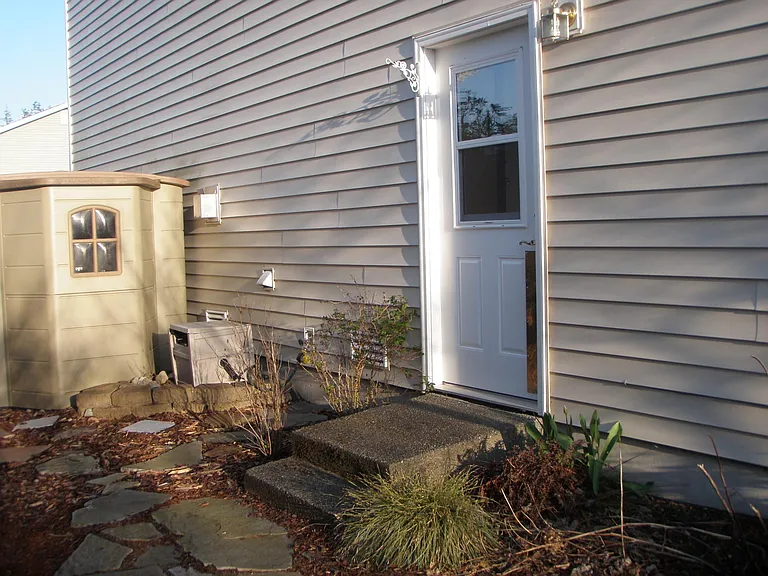 Another entrance from the side of the house by the tool shed