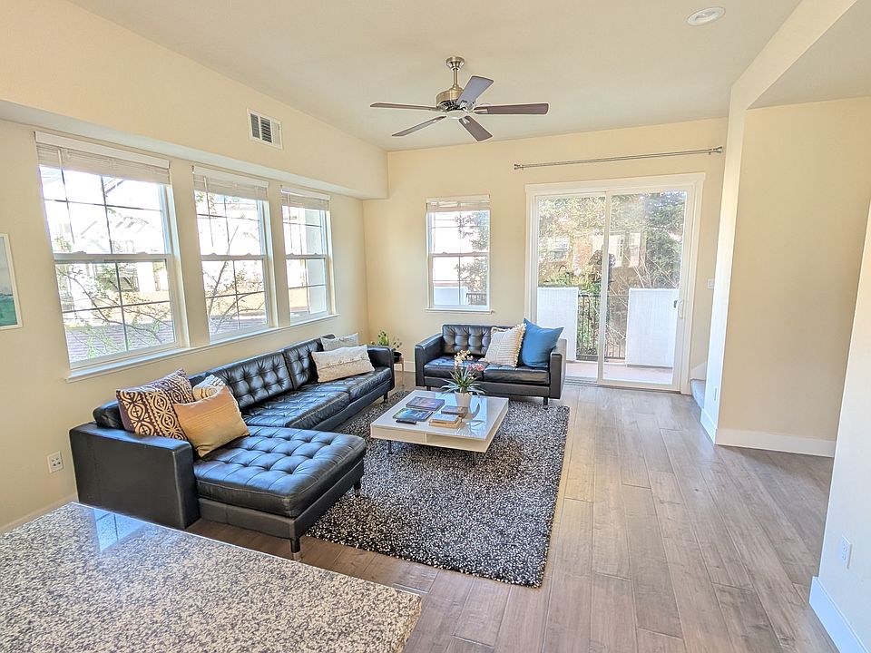 Living space - the balcony seen outside the patio door is full width of the house. Windows on both walls as it's an end unit.