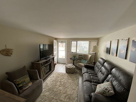 Living room w/ door to Lake