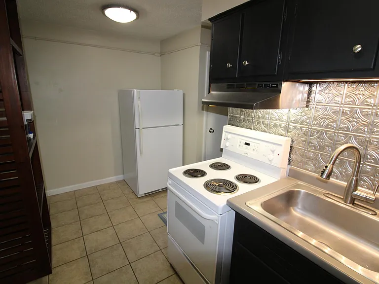 Kitchen with Fridge and wall shelf for extra storage
