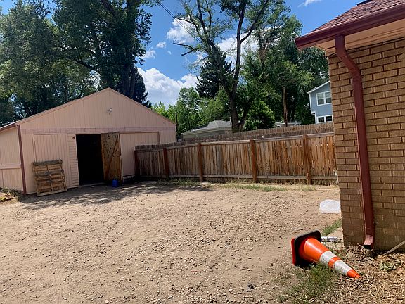 Alley parking area and detached storage building