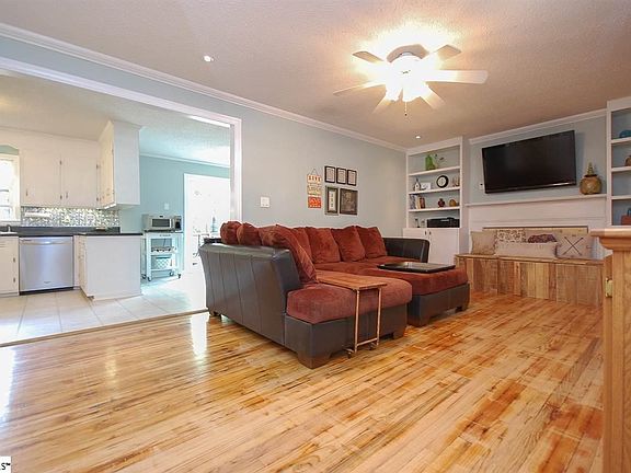 Wood burning fireplace, built in shelves & original hardwood floors
