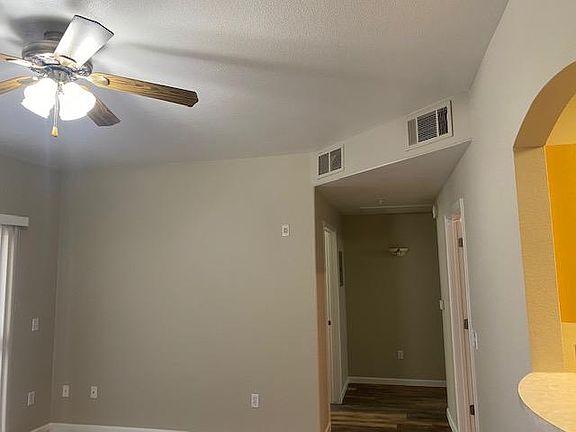 Large Living Room, with Pass-thru to Kitchen, Lighted Fan on Dimmer, All Newly Painted all surfaces, AC provides year-round comfort.