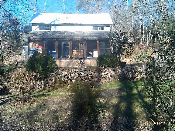 front showing covered porch from yard