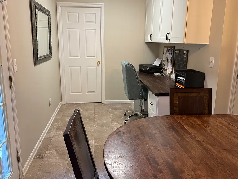 Office space/desk leading into laundry room