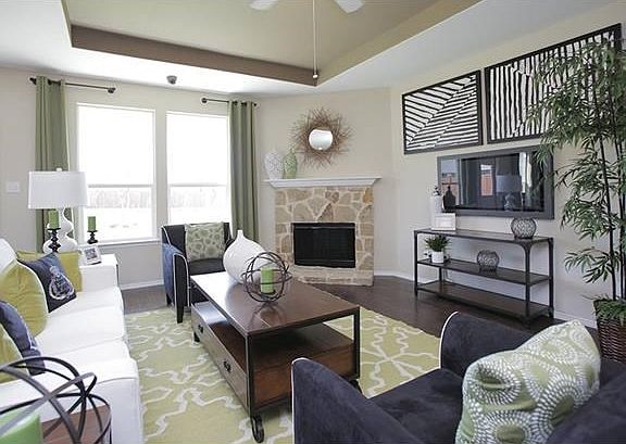Photo of Model Home with Same Floor Plan, Not of Actual Home Listed