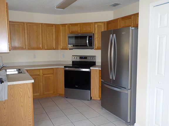 Spacious kitchen with a pantry closet.