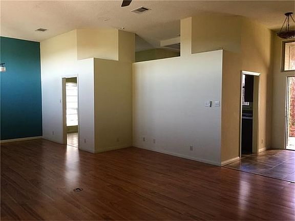 Tall ceilings in kitchen, dining, and tv room