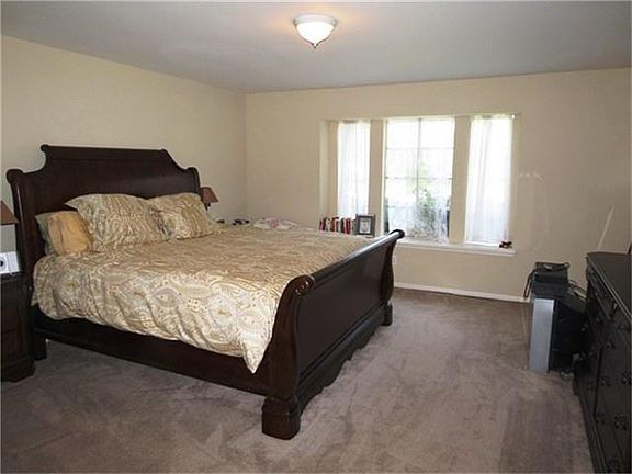MASTER BEDROOM WITH BAY WINDOW.