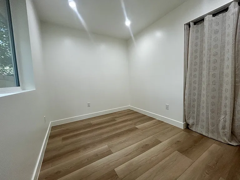 Second bedroom can be used as a guest room, home office, creative studio, or another bedroom.