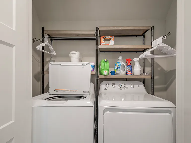 Laundry closet located upstairs includes washer and dryer