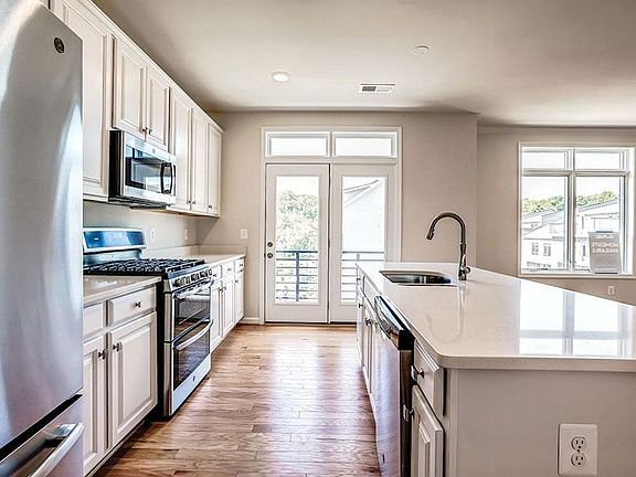 Exquisite and large kitchen area with quartz tops, upgraded cabinets and stainless steel appliances