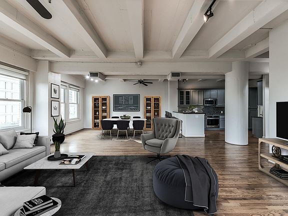 From living to dining room looking into kitchen. This corner unit has 17 windows, allowing wonderful natural lighting.