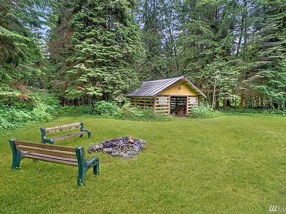 Great place to relax by the fire. Large wood shed in the background.