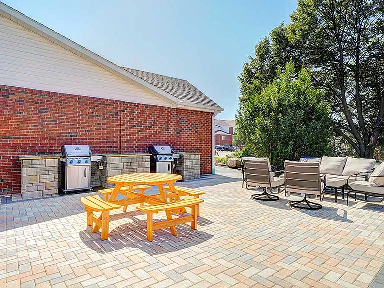 Fire up the grill and take a seat at the picnic table or lounge chairs for a perfect afternoon outdoors.