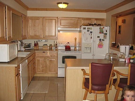 New maple cabinets and lots of room in kitchen