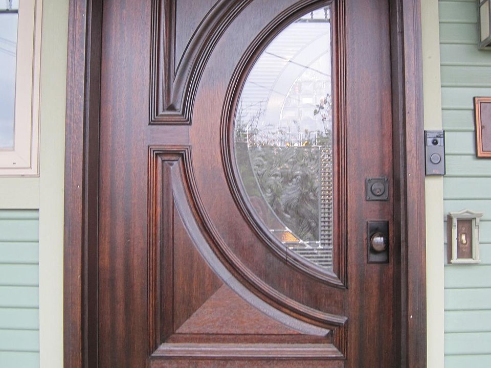 Front door with stained glass window.