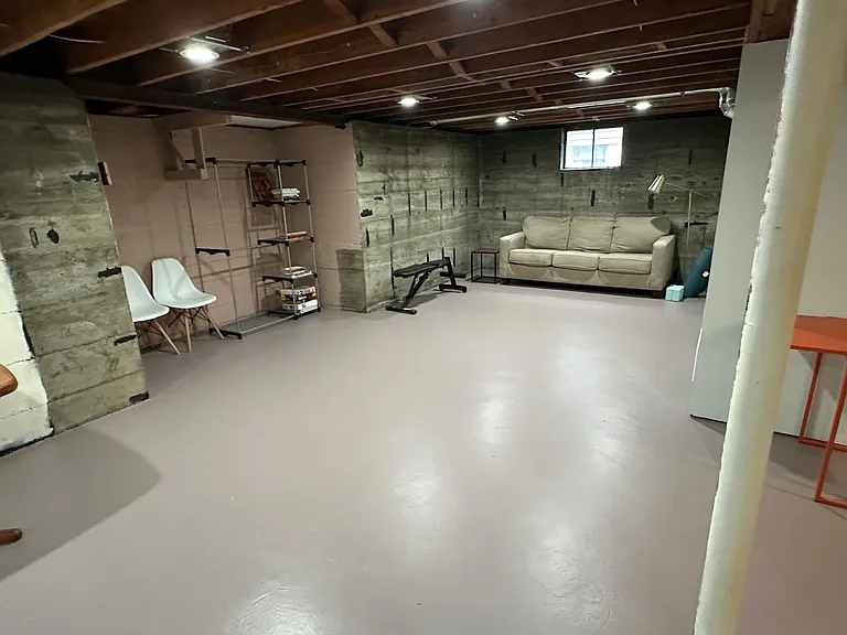 The large open basement is a great place to work out or lounge.