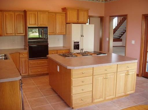 Abundance of cabinets; 2 tables with window seating