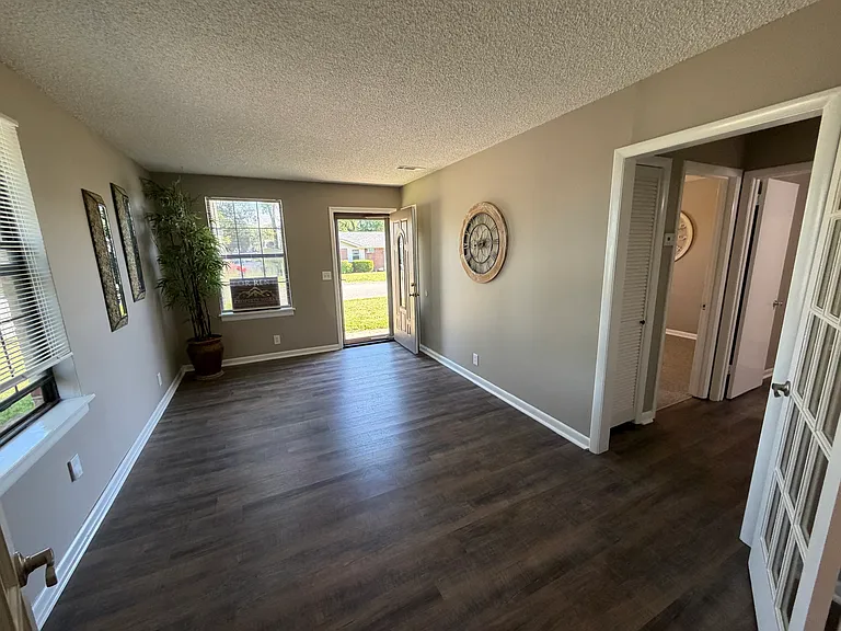 Open floor plan with french doors between kitchen and LR