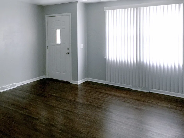 Main floor living room with large window.