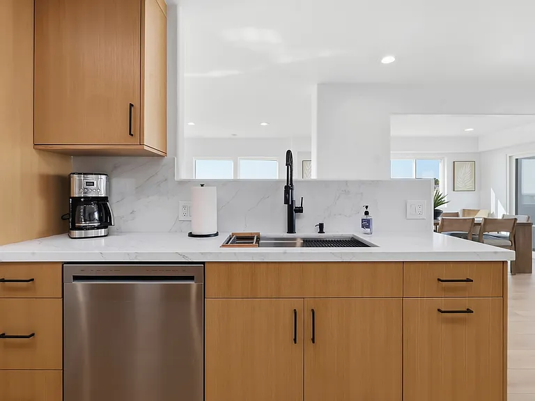 At the top of the third floor you will find a chef's kitchen with walk-in pantry, breakfast nook, 8-sit dining table, and rooftop patio with direct stair access to the street