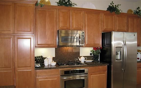 Maple cabinets with Granite and Stainless Steel appliances