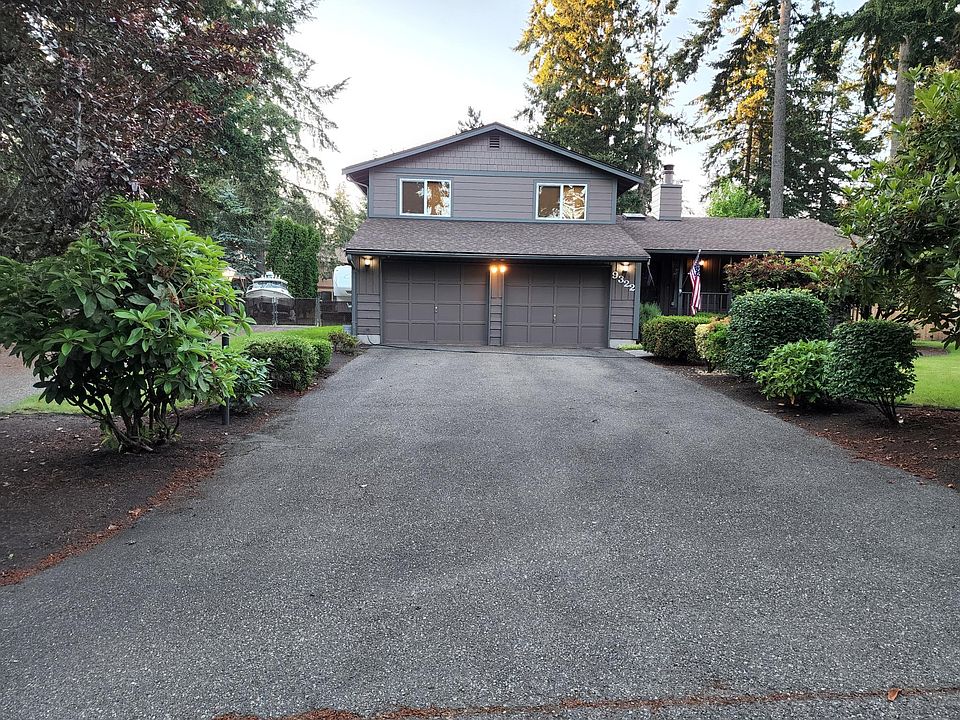 Street view, new windows in both bedrooms above garage.