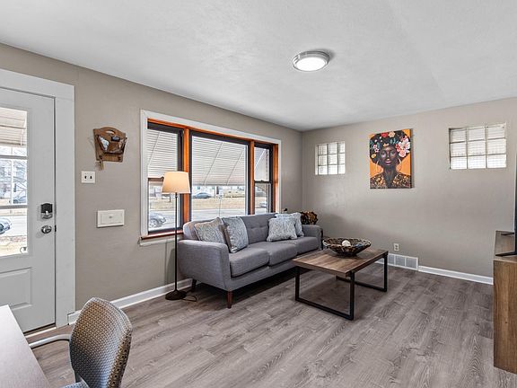Sip morning coffee on the comfy couch with a view of the front yard through the sunny window.