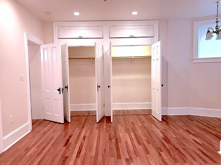 Downstairs Master Bed Room with walk-in closets, and upper storage