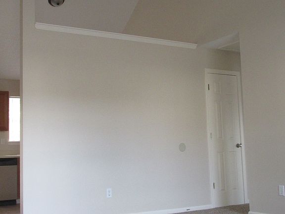 Living Room with Vaulted Ceilings and Fan