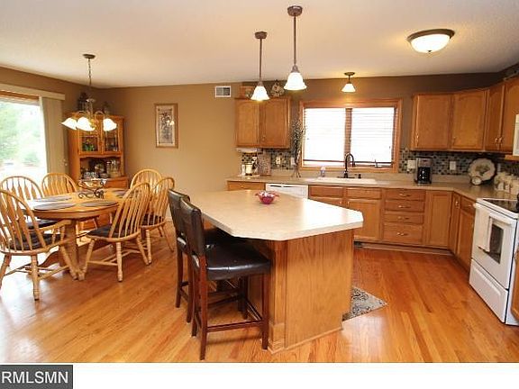 Really open to the family room, dining room and kitchen.  Three sided fireplace is the perfect creates that hearth room feel.