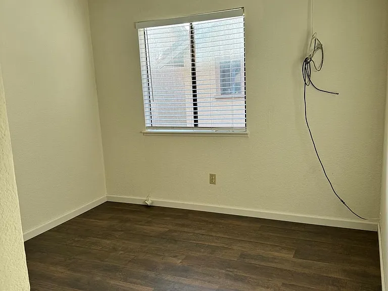 Third Bedroom with closet and ceiling fan Pergo Flooring .