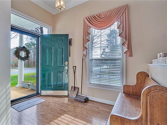 Entry foyer with lovely wood flooring
