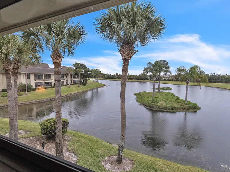 Enjoy stunning lake & golf course views from the living room!