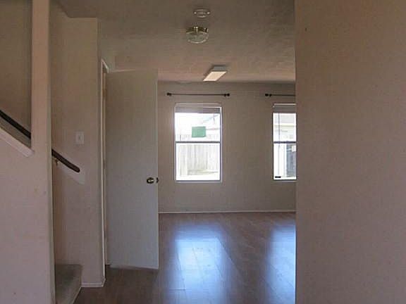 FOYER AND VIEW OF PORTON OF FAMILY ROOM