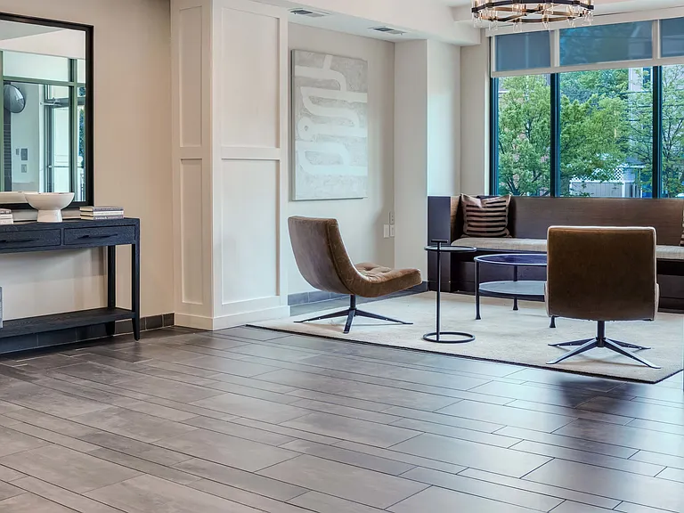 Newly redesigned leasing office with floor to ceiling windows and ample seating