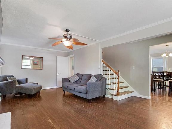 Oversized living room with hardwood floors and fireplace