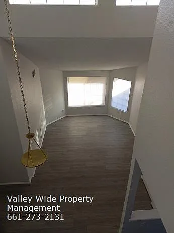 view of den from top of stairs