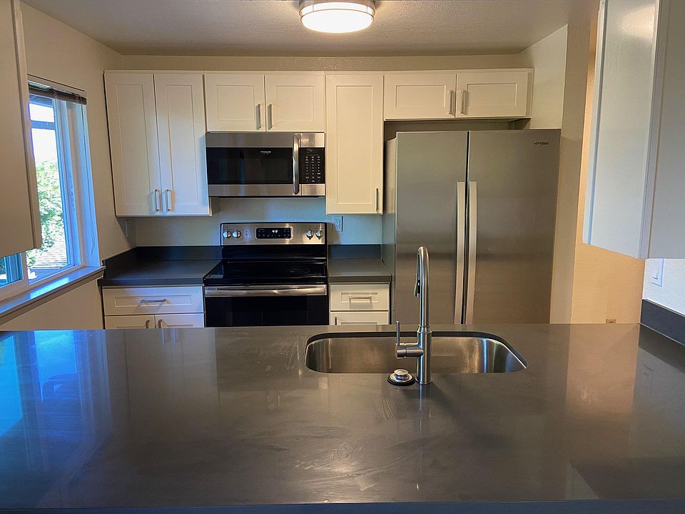 Kitchen with new cabinets, granite countertops and stainless steel appliances.