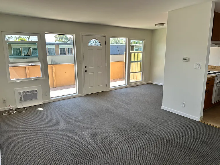 living room to private deck open to kitchen area