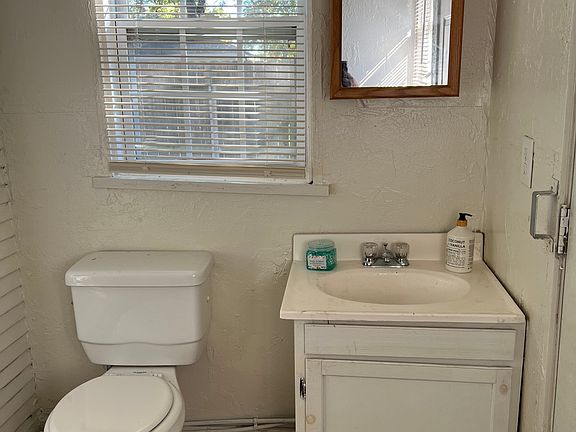 Stylish powder room just steps from the main living area.
